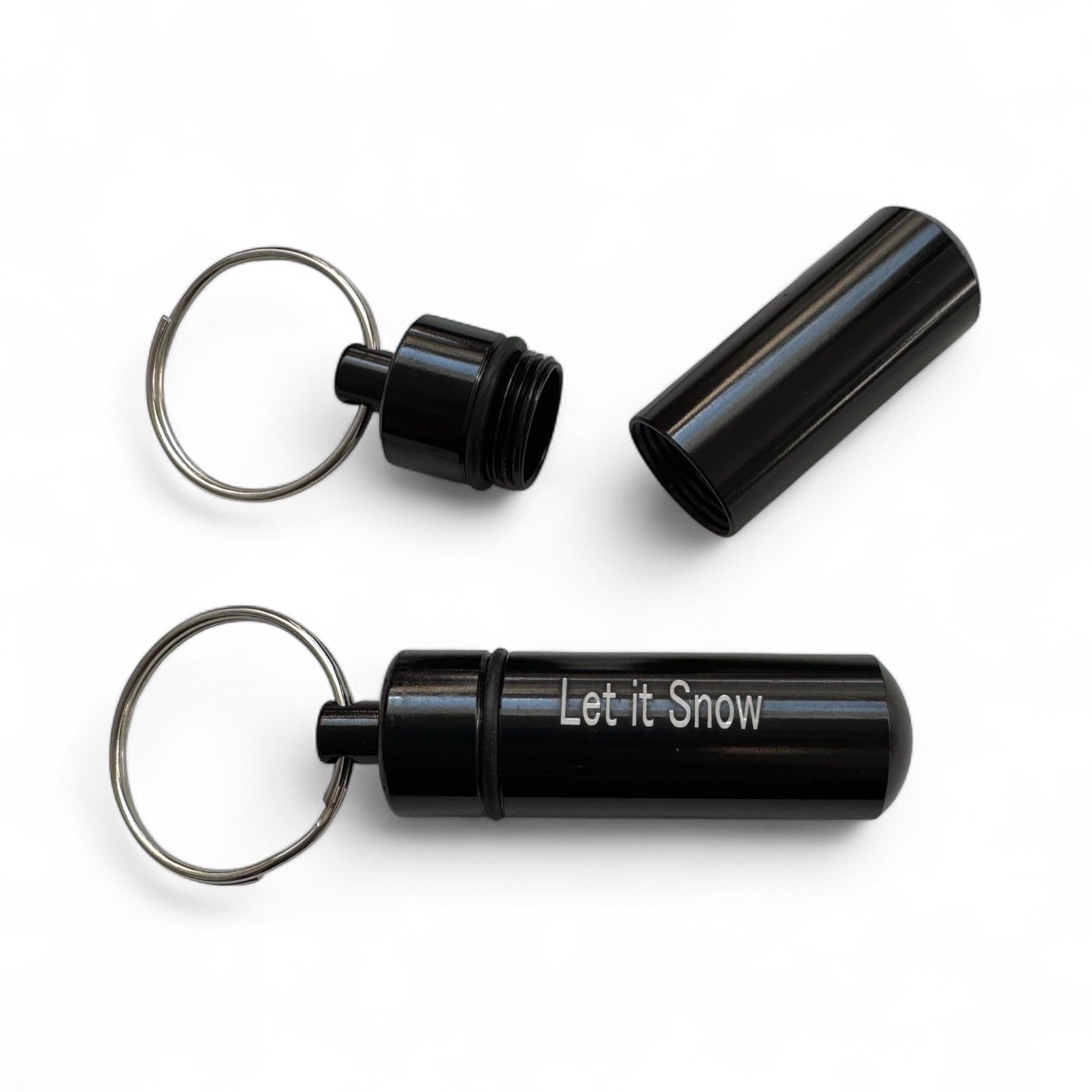Kapsel-Anhänger "LET IT SNOW" – Schwarz, diskret & stylisch